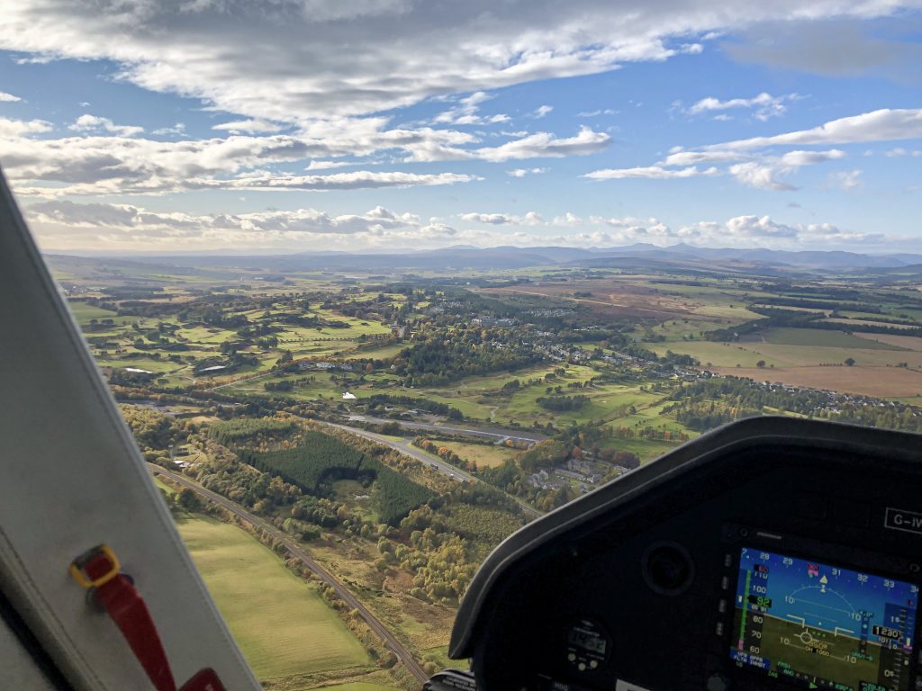 Helicopter cockpit view of british countryside. 