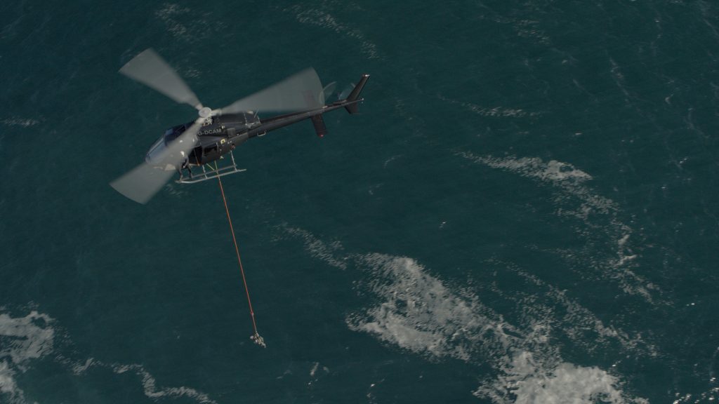 Helicopter performing Long line aerial stunt for Irelands Ultimate Hell Week The Professionals.